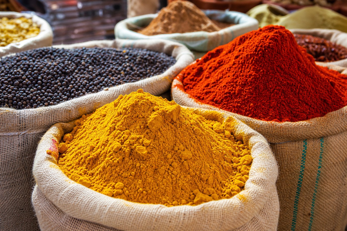 Colorful spice sacks at market